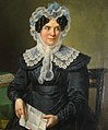 Marie Thérèse Cambier, veuve de Joseph J. Le Grelle, tableau peint par Barthélemy Vieillevoye en 1826. Mme Le Grelle tient en ses mains une lettre signée : « votre dévoué fils Gérard Le Grelle ». C’est le plus ancien tableau des ancêtres directs Le Grelle.