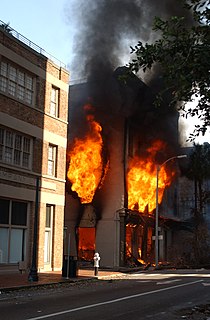 A fire raging in a downtown business at 329 Tchoupitoulas Street on the morning of September 2. New Orleans Fire 2005-09-02.jpg