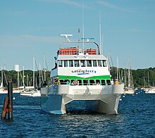 The Salem Ferry, 92 ft. Catamaran is photographed approaching its dock off Blaney Street at the Salem Maritime National Historic Site in Salem, Massachusetts, United States. Salem Ferry.JPG