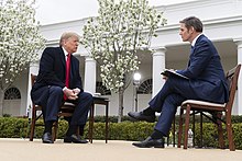 Hemmer interviewing President Donald Trump in 2020 Virtual Fox News Town Hall (49694597098).jpg