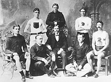 Several members of America's first Olympic team in 1896. Standing: T.E. Burke, Thomas P. Curtis, Ellery H. Clark. Seated: W.W. Hoyt, Sumner Paine, trainer John Graham, John B. Paine, Arthur C. Blake. 1896 US olympic athletes.jpg