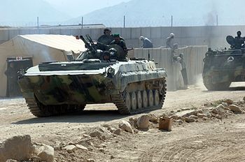 Afghan National Army soldiers depart in armore...