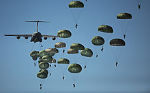 82nd Airborne Division paratroopers parachuting from a U.S. Air Force C-17 Globemaster III transport plane Defense.gov News Photo 110910-GO452-406 - U.S. Army paratroopers from the 82nd Airborne Division descend to the ground after jumping out of a C-17 Globemaster III aircraft over drop zone.jpg