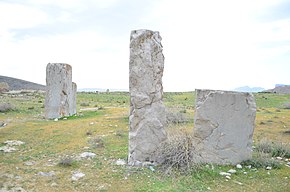 Photograph of three columns of different sizes at Istakhr