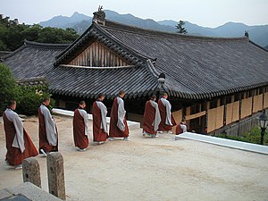 Monks going down to their rooms after evening ...