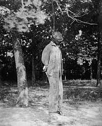 An unidentified African-American man lynched from a tree, 1925 Lynching2.jpg