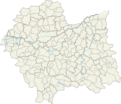 Mapa konturowa województwa małopolskiego, blisko centrum na lewo u góry znajduje się punkt z opisem „Kraków”