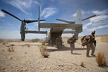 Marines disembark from an MV-22 near Marine Corps Air Ground Combat Center Twentynine Palms, California, 2019. Marine Medium Tiltrotor Squadron 263 disembarks from MV-22B Osprey (48464541017).jpg