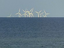 An image of Thorntonbank Wind Farm (near the Belgian coast) with the lower parts of the more distant towers increasingly hidden by the horizon, demonstrating the curvature of the Earth Offshore windpark Thorntonbank.jpg