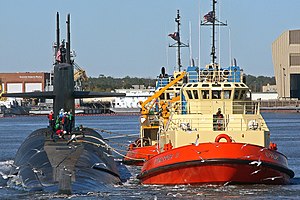 The C-Tractor 3, sister ship to the William M, escorts the U.S. Navy ballistic-missile submarine USS Rhode Island (SSBN-740).