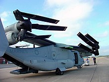 A V-22 in a compact storage configuration during the Navy's evaluation, 2002 V-22 Osprey wing rotated.jpg