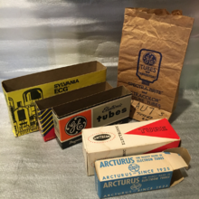 Commercial packaging for vacuum tubes used in the latter half of the 20th century including boxes for individual tubes (bottom right), sleeves for rows of the boxes (left), and bags that smaller tubes would be put in by a store upon purchase (top right) Vacuum Tube Commercial Packages.png