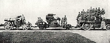 Barrel, body and crew towed by an M 12 tractor, circa. 1914.