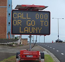Roadside hospital advice in Burnie, Tasmania, telling people to call emergency services or head to Launceston General Hospital. Covid-19-sign-Burnie-20200415-001.jpg