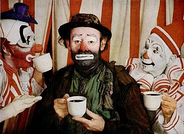 Emmett Kelly in his Weary Willie persona (center) with two Ringling Bros. whiteface clowns in a 1953 advertisement for the Pan-American Coffee Bureau