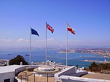 The Union Jack, with the flags of the European Union and Gibraltar on its sides. The Union Flag is placed in a raised, central position. Gibraltar GM 2008 (61).JPG