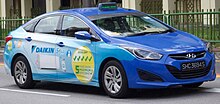A taxicab with an advertisement for Daikin in Singapore. Buses and other vehicles are popular media for advertisers. Hyundai i40 with Daikin Advertising operating under Comfort taxis.jpg