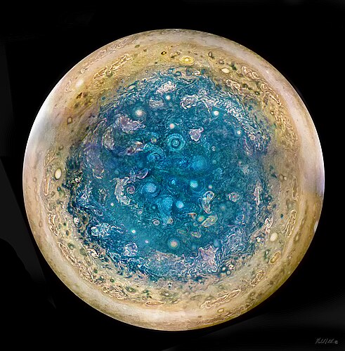 Jupiter's south polar region by Michael S. Adler. A composite image showing a series of cyclones averaging 6000 miles in size. This is the first time the polar regions of Jupiter have been observed and is made possible by the unique polar orbits of the Juno spacecraft. National Jury's Choice Award