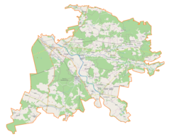 Mapa konturowa powiatu niżańskiego, blisko centrum na lewo u góry znajduje się punkt z opisem „Nisko”