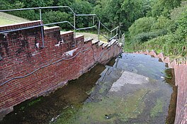 An image of the spillway to lower Slade reservoir