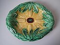 Bread plate or corn platter, temperature compatible coloured glazes on biscuit, naturalistic in style, surfaces molded in relief.