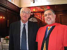 A South African PhD graduate (on right, wearing ceremonial gown) BJCroome UCT PhD Graduation 2008.jpg