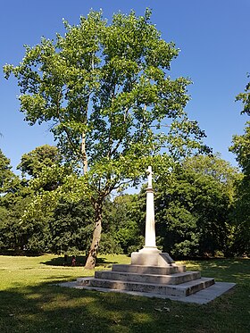 Cross in Battersea Park, erected to mark the year 2000. It stands on the site of a manor granted by King Caedwalla to St Erkenwald which is believed to have been the home of St Ethelburga. Battersea Millennium Cross 20200625 101621 (50043201896).jpg