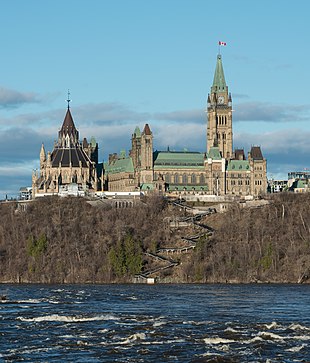 The Canadian Parliament Buildings from the Ottawa River, including Gothic Revival library at rear, built between 1859 and 1876 Centre Block and Library of Parliament, Ottawa, West view 20170422 2.jpg