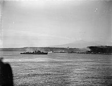 A destroyer fires on Axis positions while Commandos carry out landings on the beach during Operation Husky. Commando landings Sicily 9 10 July 1943.jpg