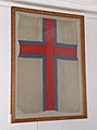 I kirken hænger Færøernes første flag Merkið