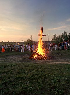 Ritual of the sword planted into a pile of stones or brushwood, to honour the martial deity (Perun), practised by Russian Ynglists in Omsk, Omsk Oblast. It is a Scythian ritual. Kupala-Omsk-Perun-Sword-Fire.jpg