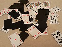 Playing cards spread on floor.jpg