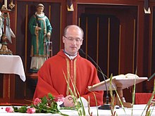 A Catholic priest during Holy Mass Prokop Broz.jpg