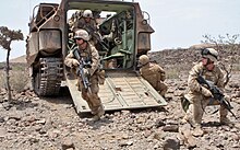 U.S. marines dismounting from an Assault Amphibious Vehicle in Djibouti 1st platoon, Alpha Company, 1st Battalion, 9th Marine Regiment, 24th MEU, Djibouti, 2010.jpg