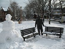 A statue of Al Waxman, a local who was raised in the area, and starred in CBC Television's King of Kensington. Al and the Snowman (1).jpg