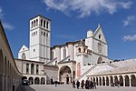 A white church with some people in front