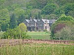 a country house surrounded by trees