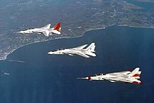 Grumman's VFX entry was designed around the TF30 engine, AWG-9 radar and AIM-54 missile intended for the F-111B; this eventually became the F-14A. F-14 Tomcat prototypes in flight c1972.jpg
