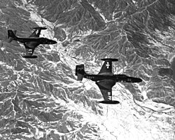 VF-11 F2H-2 escorts a VC-61 F2H-2P over Korea in 1953 F2H2 F2H2P over Korea 1953.jpeg