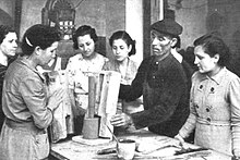 Barcelona, early 1939: women learning to replace males in production Females taught manufacturing jobs at Barcelona factory.jpg