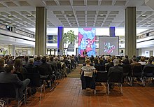 Hall of the Central Library filled with people at the ceremony of Würzburg University Library