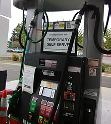 Signage at a gas pump in Portland showing temporary self-serve Gas pump in Portland, Oregon during COVID-19 exemption.jpg
