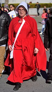 A member of the political action group The Handmaid Coalition Handmaid (28044961559), cropped.jpg