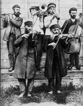 Klezmer fiddlers at a wedding, Ukraine, ca. 1925 KLEZPO.png