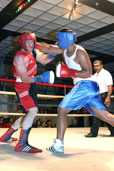 The fighters in this Amateur boxing bout are wearing headgear. Ouch-boxing-footwork.jpg
