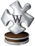 «Жақсы мақала» марапаттамасы — Уикипедия нышаны бар дизайн