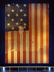 The 15-star, 15-stripe "Star-Spangled Banner" that inspired the poem Star Spangled Banner Flag on display at the Smithsonian's National Museum of History and Technology, around 1964.jpg