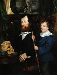 Oil painting of Thomas Bateman seated at a table with right hand on an ancient skull, with his young pre-teen age(?) son William Thomas Bateman standing at his father's left side, holding a thin wooden rod.