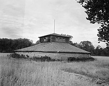 Dance lodge from the Elbowoods area on the Fort Berthold Reservation. Built in 1923, this is a wooden version of the classic Mandan earthwork lodge. This area was flooded in 1951. From the Historic American Engineering Record collection, Library of Congress. Wooden dance lodge.jpg