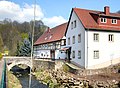 Neudeckmühle: ehemaliges Mühlengebäude, später Gasthaus (zwei Wohnhäuser in Ecklage aneinandergebaut), dazu Zufahrtsbrücke über die Wilde Sau (Saubach)